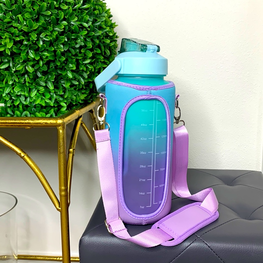 🍭  64oz Water Bottle with Adjustable Carry Strap